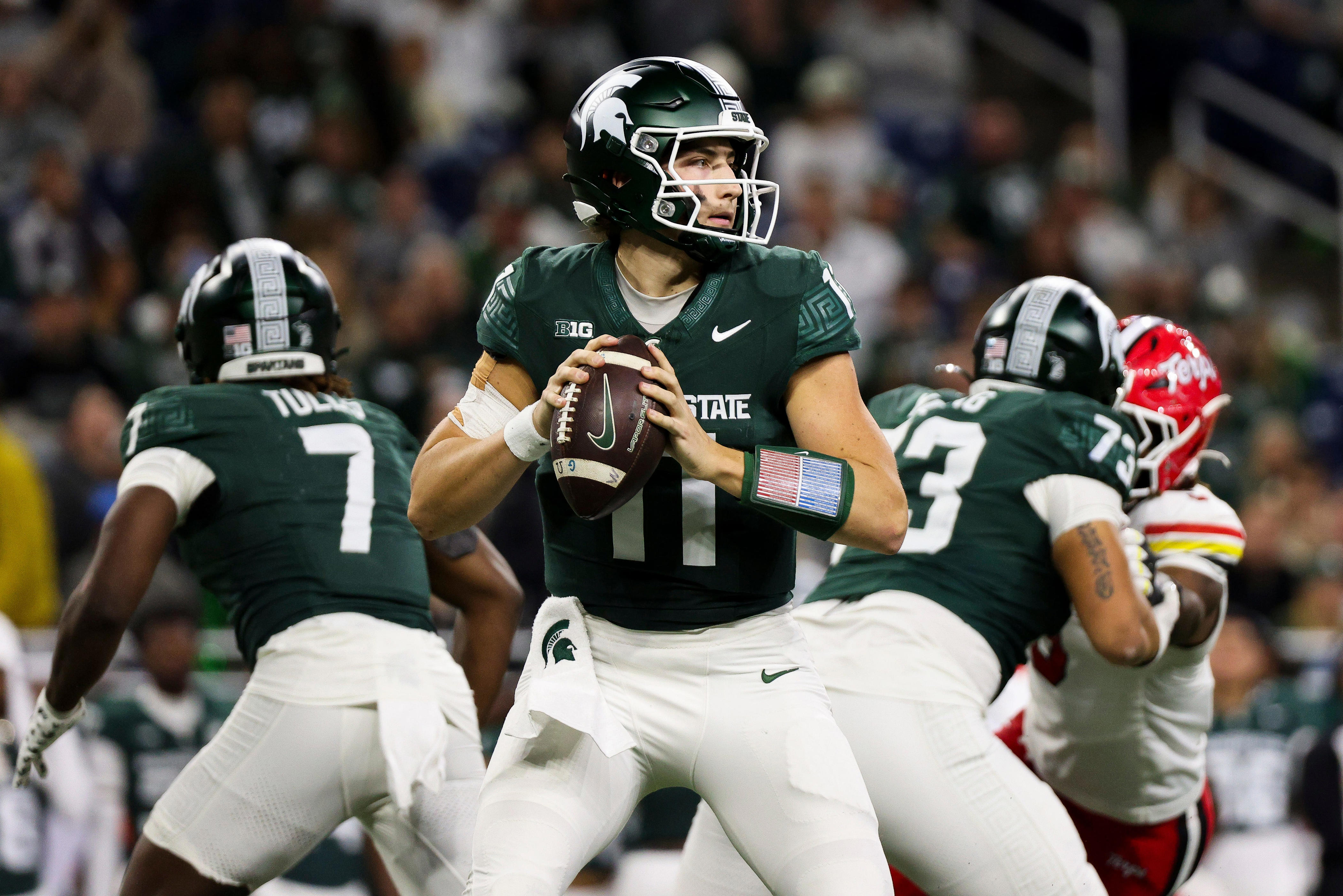 DETROIT, MICHIGAN - NOVEMBER 29: Alessio Milivojevic #11 of the Michigan State Spartans looks to throw a pass during the third quarter of a game against the Maryland Terrapins at Ford Field on November 29, 2025 in Detroit, Michigan. (Photo by Mike Mulholland/Getty Images)