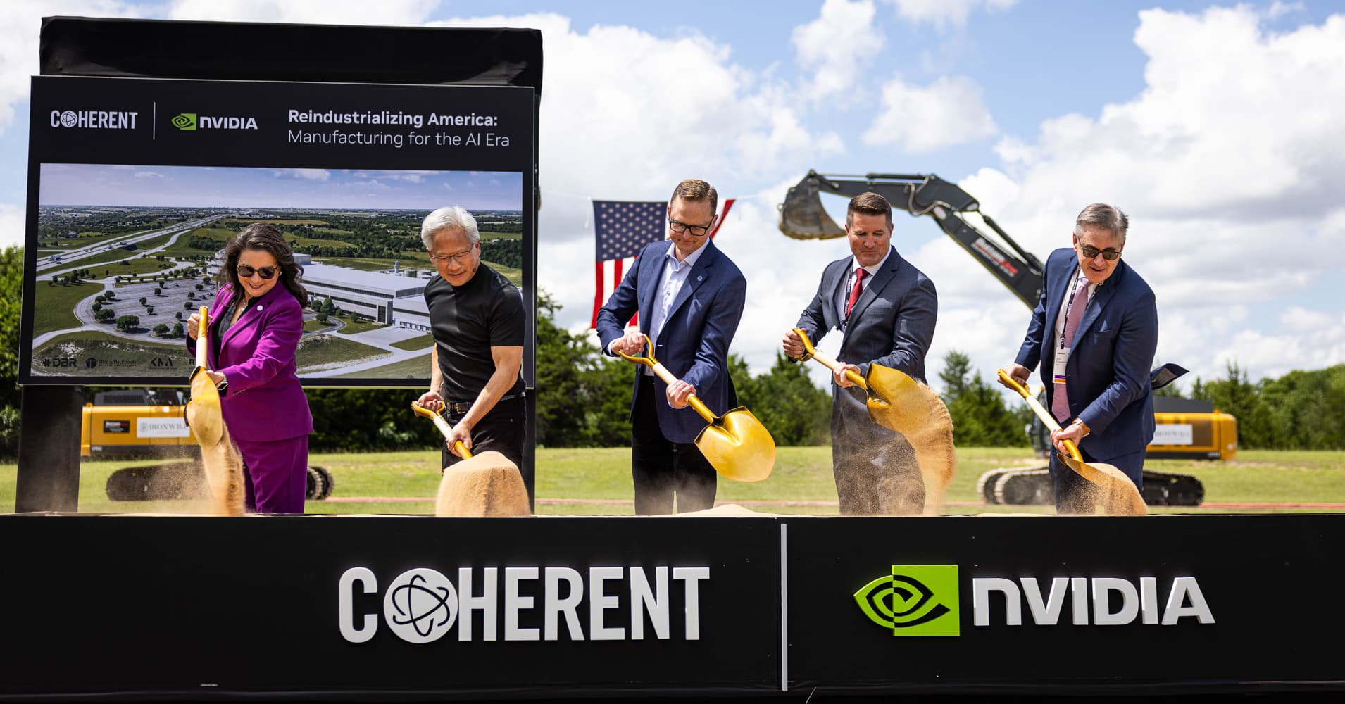VIPs from left, Executive Director, Texas Economic Development & Tourism Office Adriana Cruz, NVIDIA Founder and CEO Jensen Huang, Coherent CEO Jim Anderson, Sherman Mayor Shawn Teamann, and Director of the CHIPS Program Office with the Department of Commerce Bill Frauenhofer flip dirt in a trough during a ground breaking at Coherent's advanced manufacturing facility in Sherman, Texas on June 16, 2026.