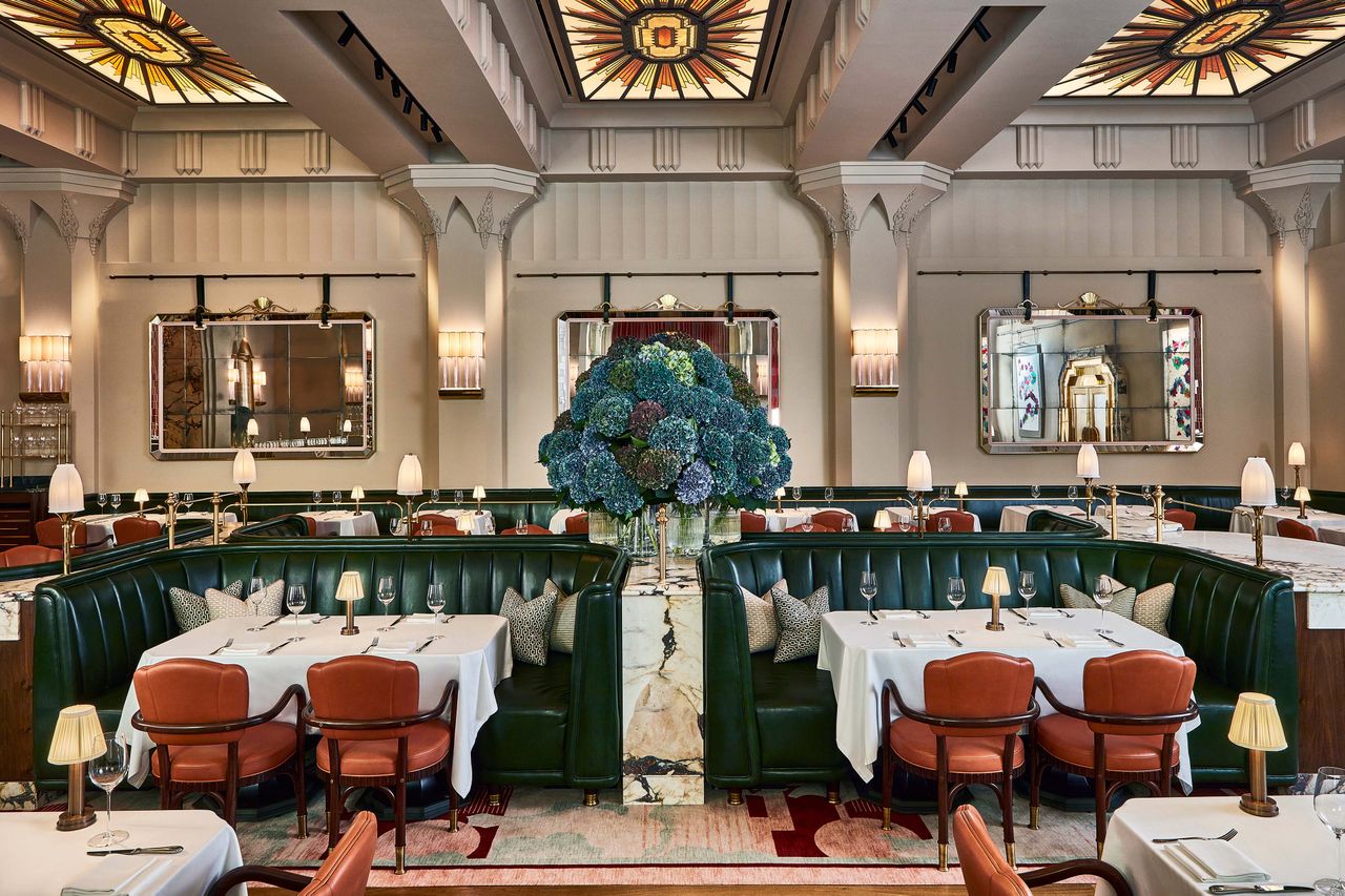 Luxury restaurant interior with elegant booths and a centerpiece floral arrangement