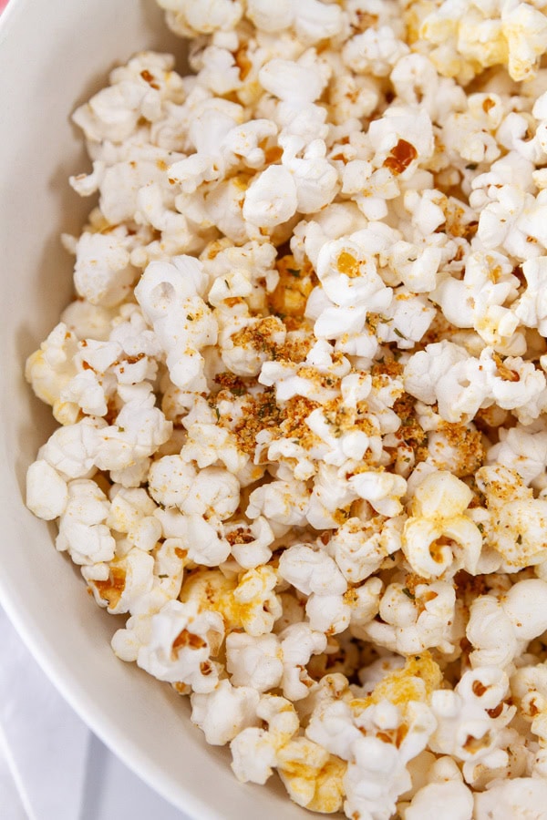 close up on seasoned sour cream and onion popcorn.