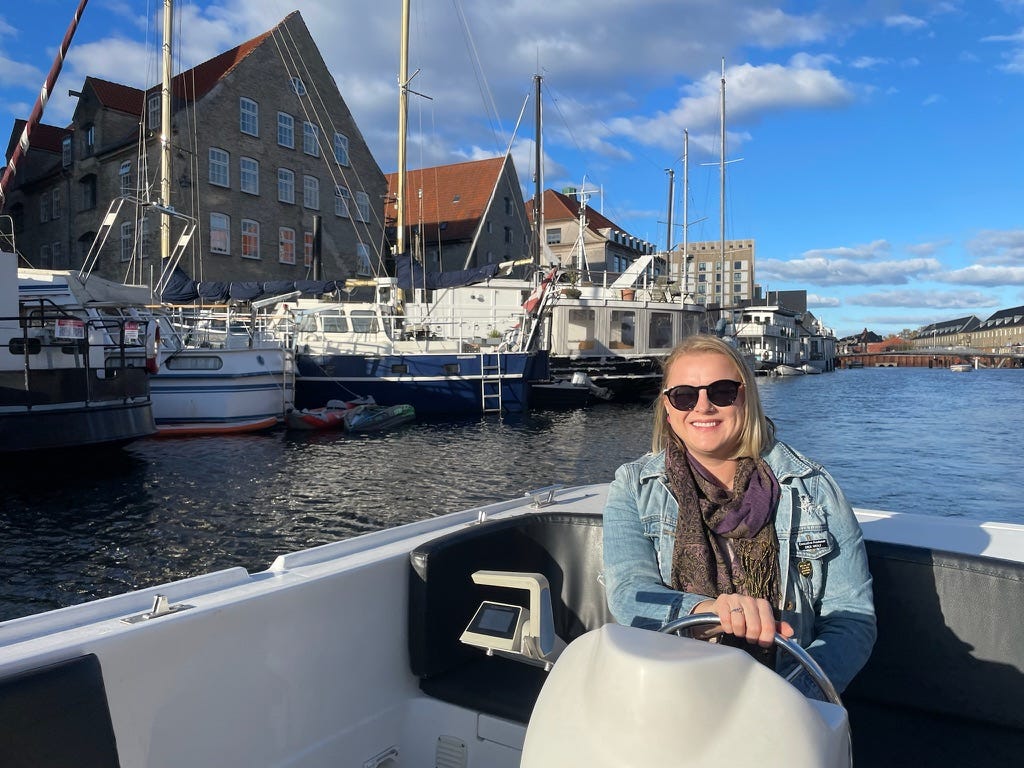 Woman smiling on boat in Copenhagen