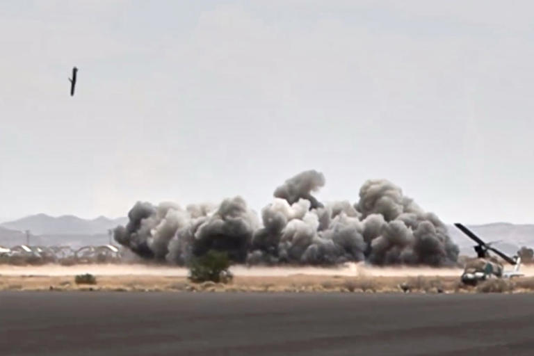 This image taken from video broadcast by Al-Masirah TV, a Houthi-controlled news channel, shows a projectile striking the Sanaa International Airport compound during what the Iranian-backed Houthi rebels in Yemen said were several Saudi airstrikes in Sanaa, Yemen, Monday, July 13, 2026. (Al-Masirah TV via AP)