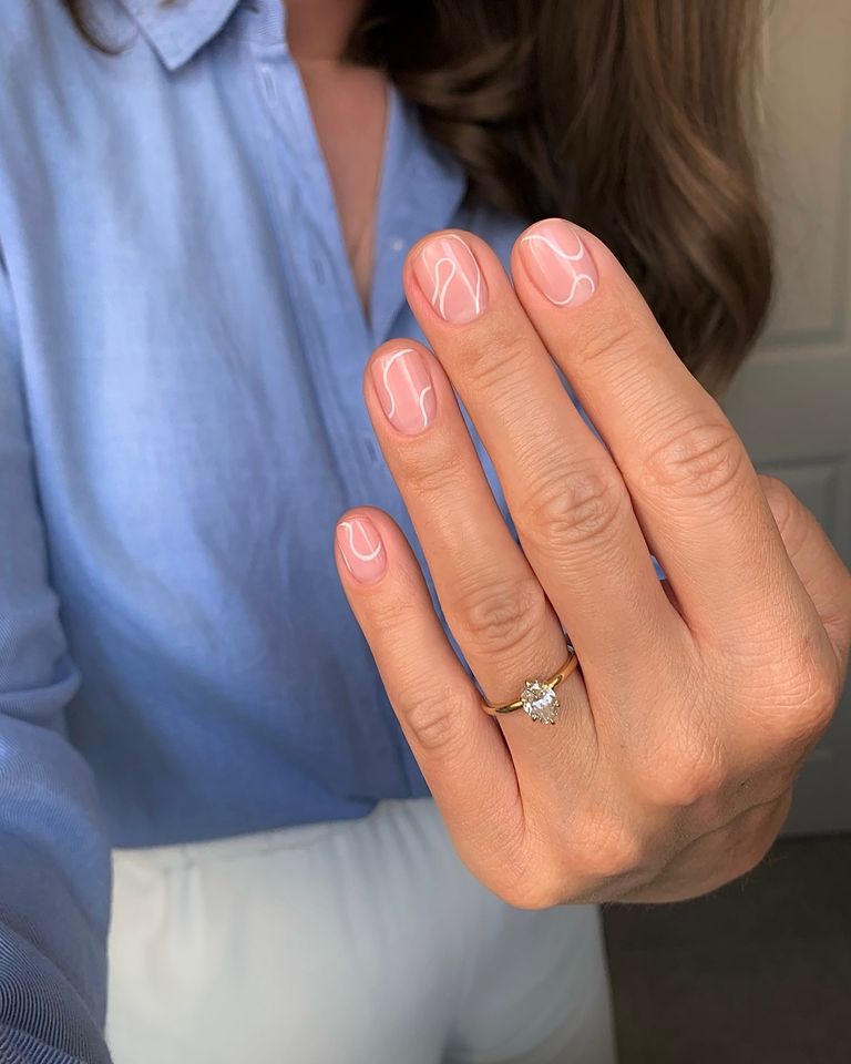 Clear nails with wavy white lines