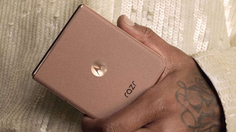 A close-up of a person holding the Motorola Razr+