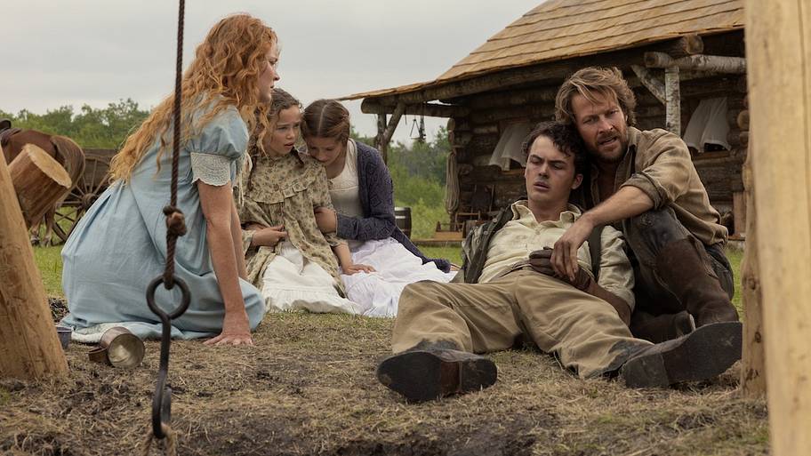 After rescuing Adam from the well, the family takes a moment to recover from the ordeal.