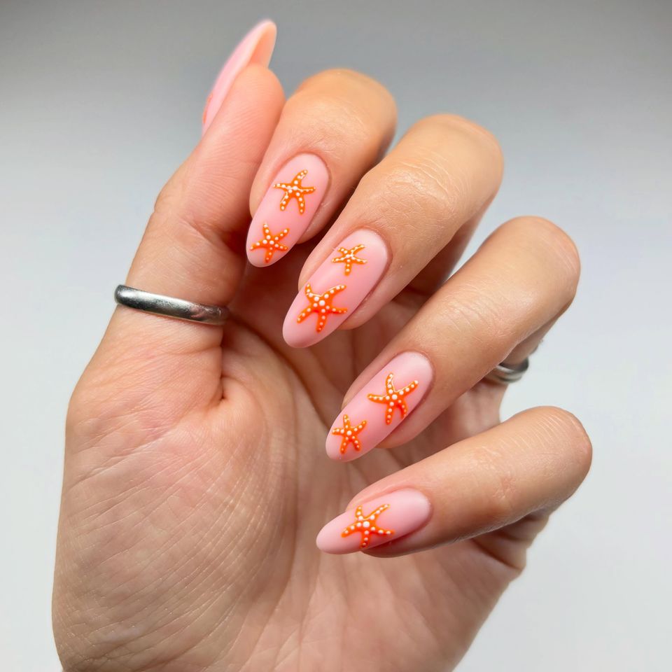 Matte nude nails with orange starfish