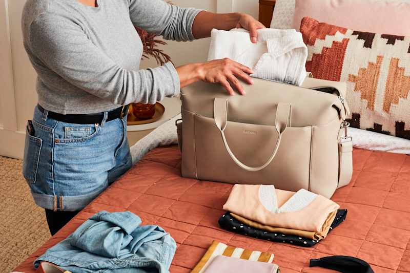 shot of someone packing a duffle bag