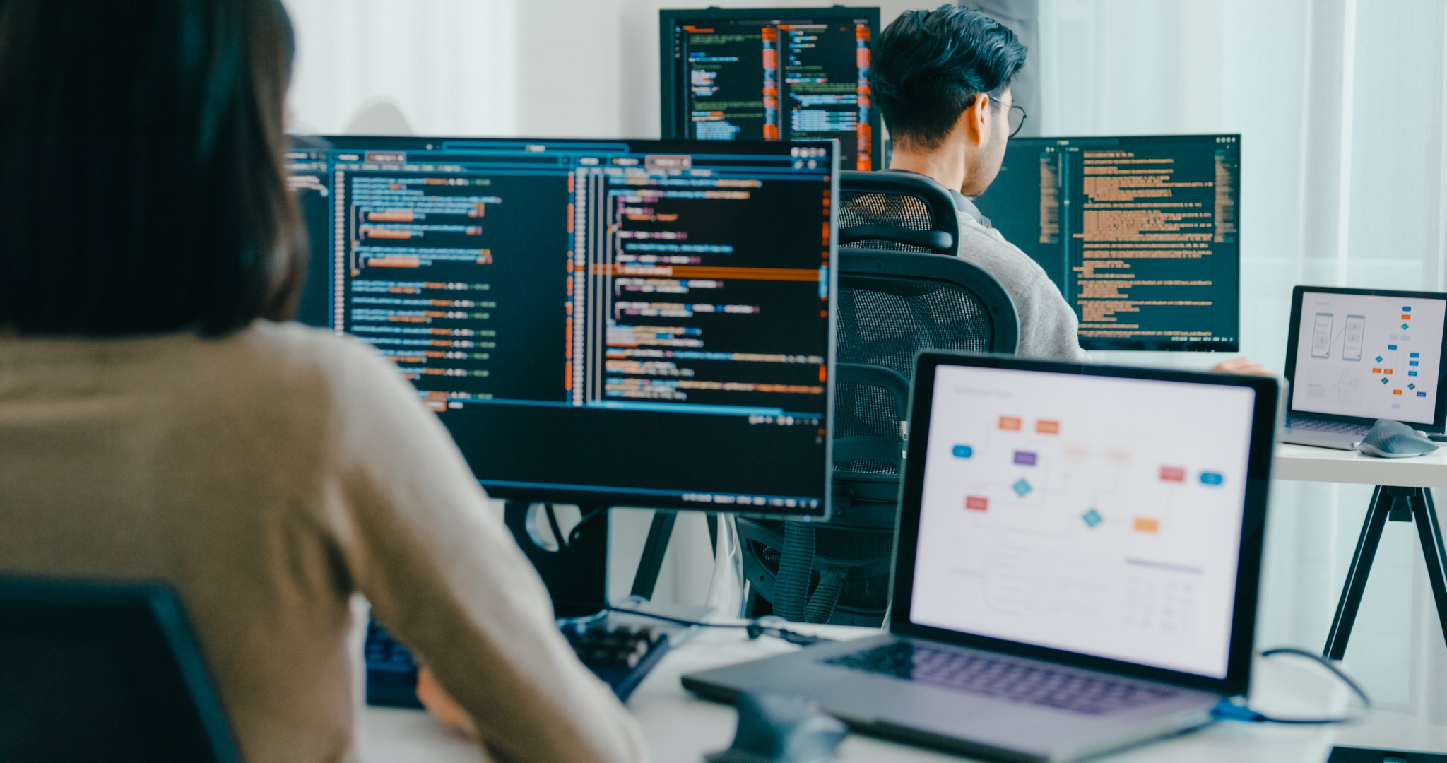 Group Asia male, female freelance typing write prompt AI bot IT app smart program nomad, video game, terminal with coding language, user interface, designer, big data center on desktop computer.