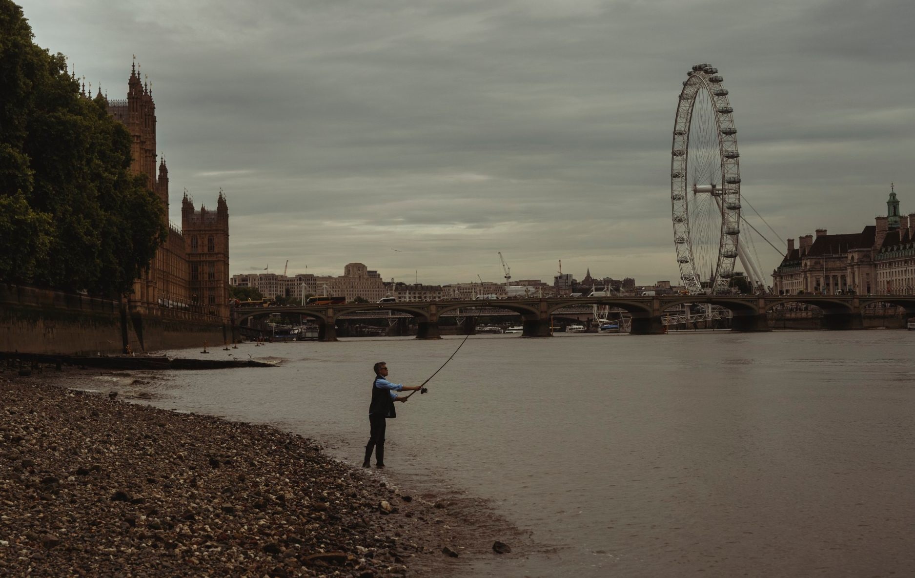 Londoner Andrej Urosevic fishing in the Thames