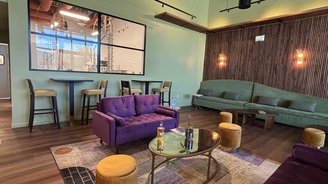 The interior of Central Coast Distillery in Atascadero is colorful - with purple and green couches and tables of two, seen here on July 2, 2026.