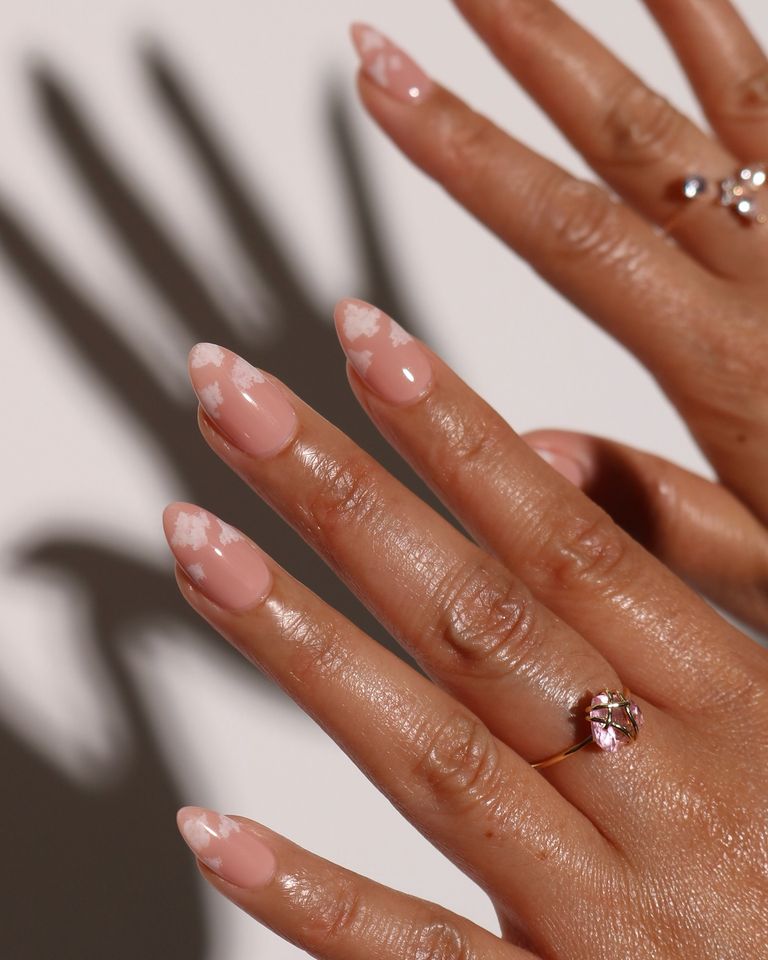 Nude nails with cloud designs