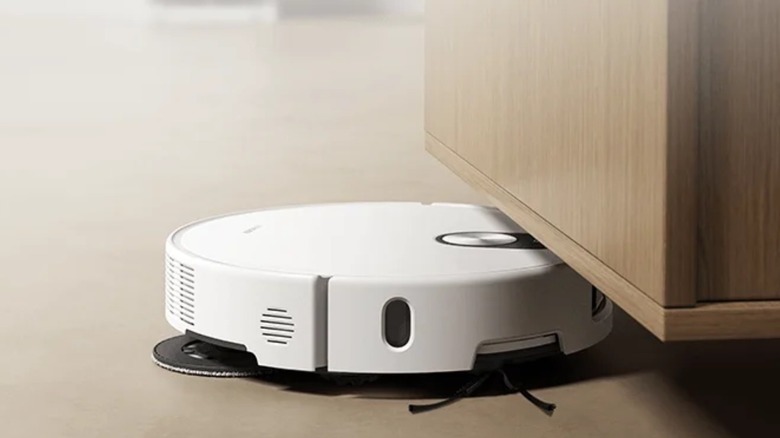 A robot vacuum going underneath furniture