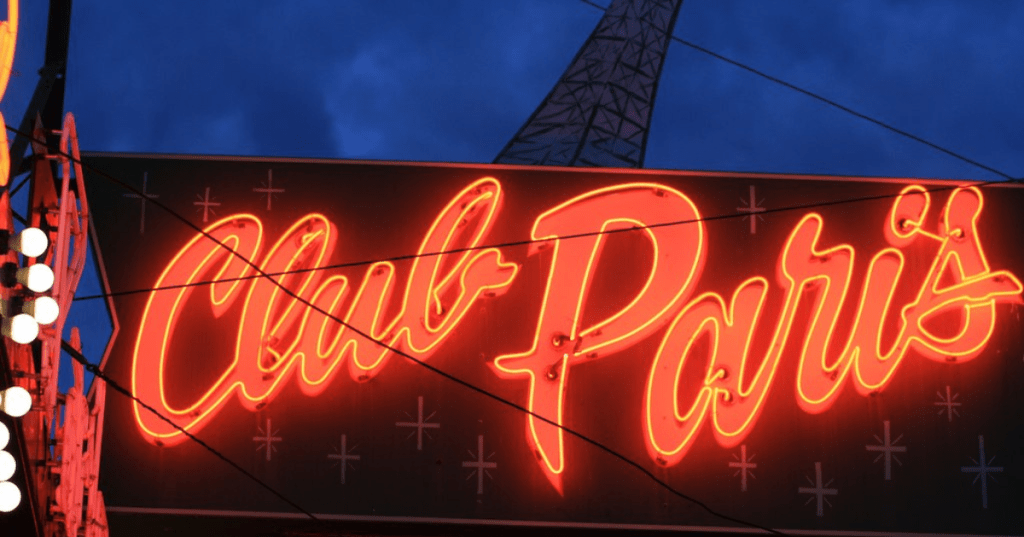A neon sign lit up at Club Paris, Anchorage's Oldest Steakhouse.
