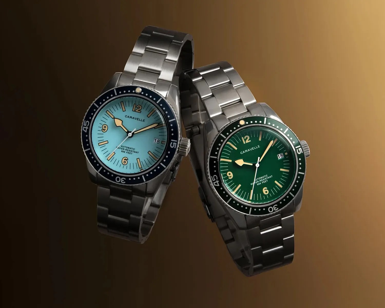 Two Caravelle wristwatches with stainless steel bands, one with a blue dial and the other with a green dial.