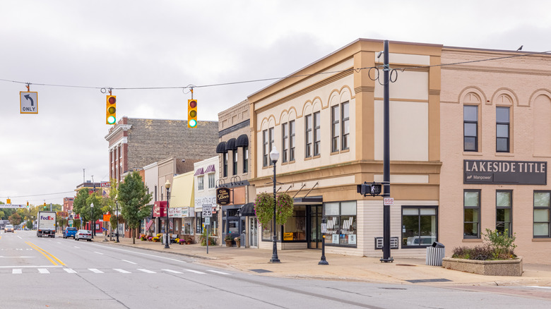 The downtown block in Cadillac with two-story brick buildings on a slightly overcast summer day