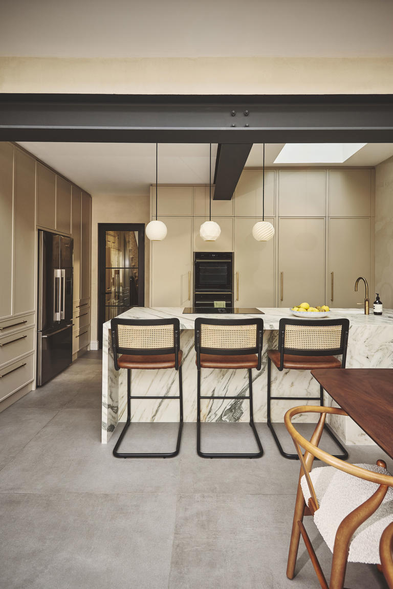 With a hidden pantry and pocket door cabinets, this London kitchen does ...
