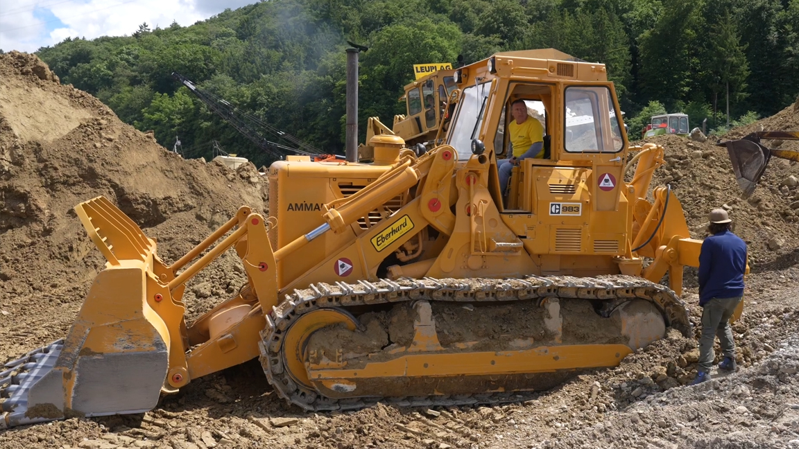 Heavy earthmoving equipment at work on large construction projects