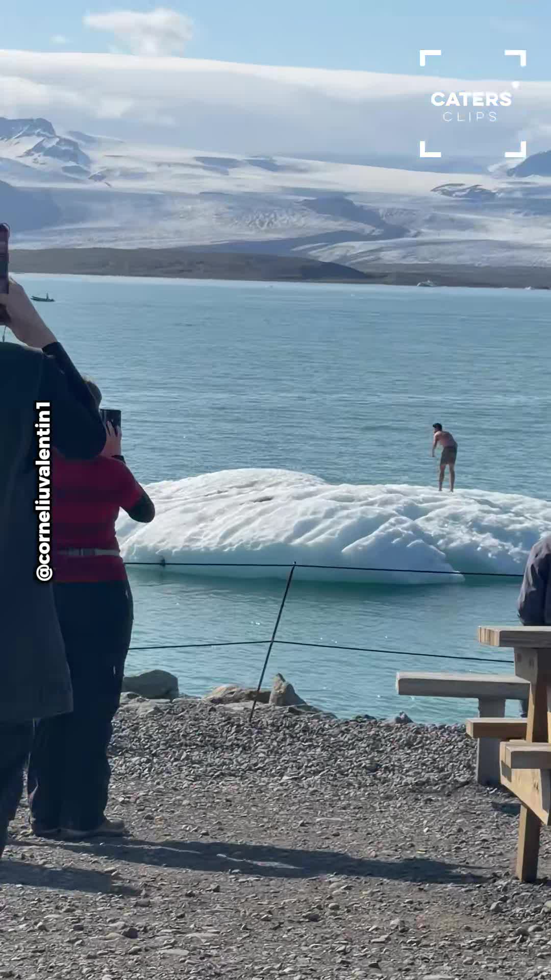 Heart-stopping moment tourist climbs floating iceberg