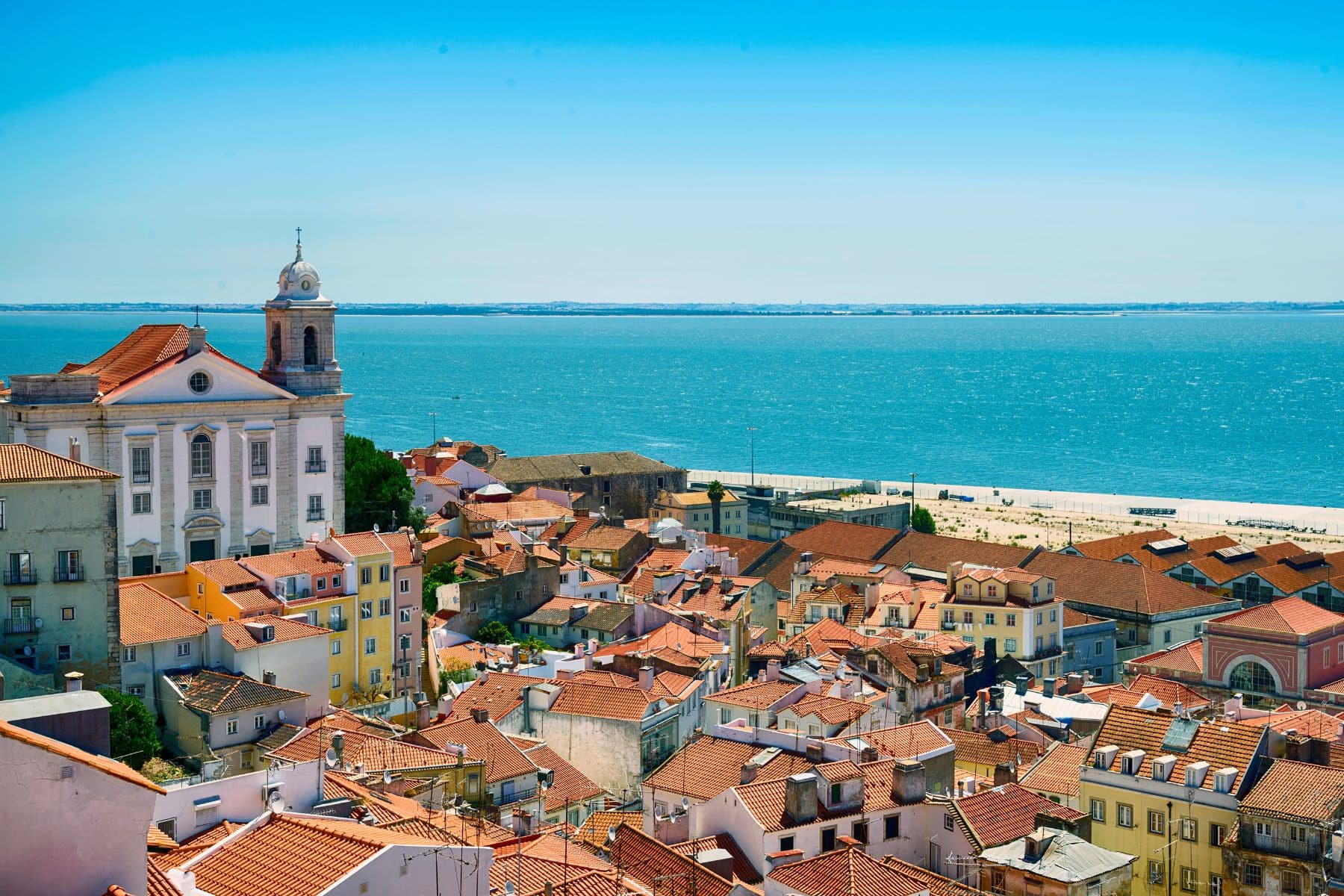 Lisbon’s gentle rhythm: where city life meets the sea and time slows to a human pace. Photo by minemero from Getty Images Signature via Canva