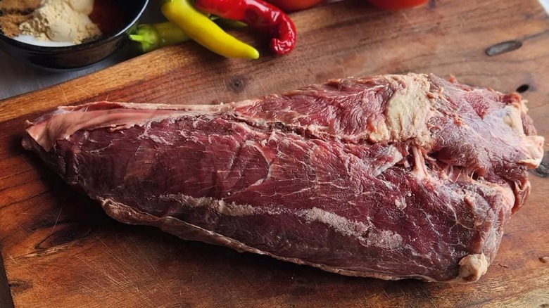 Raw mock tender beef on wood cutting board