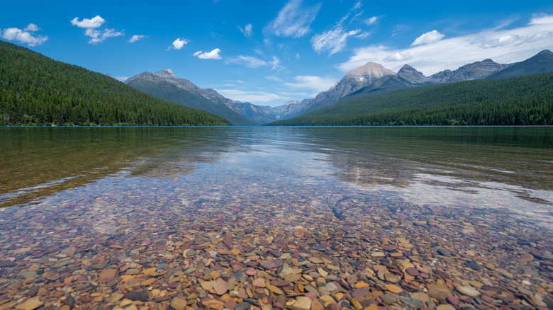 Hidden In Montana's Mountains Is A Less Crowded Shoreline With Incredibly Vibrant Rocks Like Lake McDonald