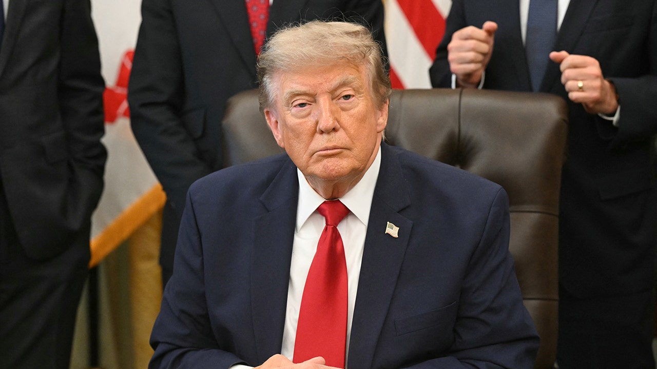 US President Donald Trump looks on after signing an executive order to drastically shrink two national monuments in Utah, paving the way for fossil fuel extraction and mining.