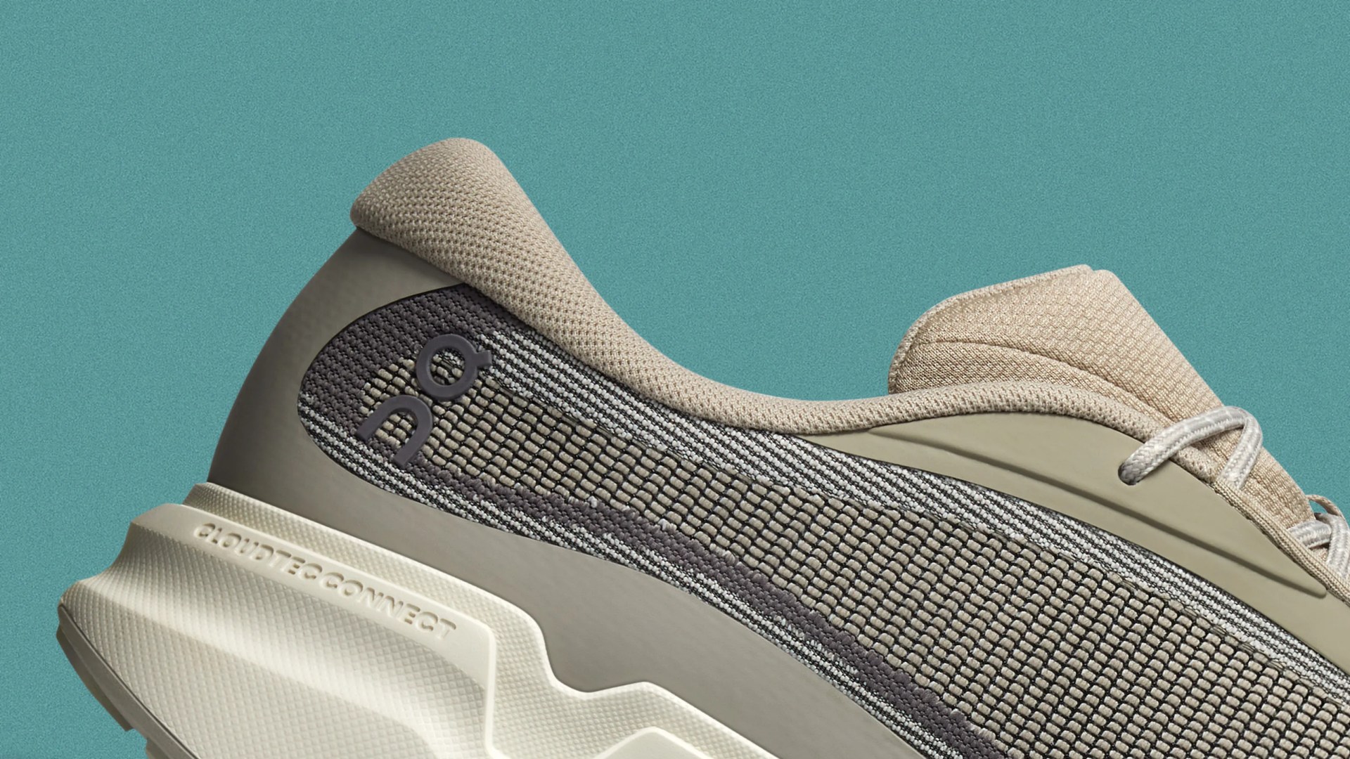 Beige and gray knit fabric sneaker with cushioned sole labeled 