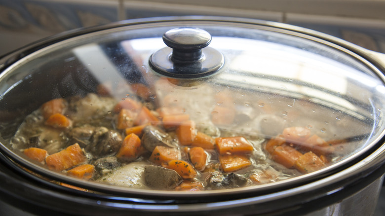 Close-up of food cooking in a slow cooker appliance