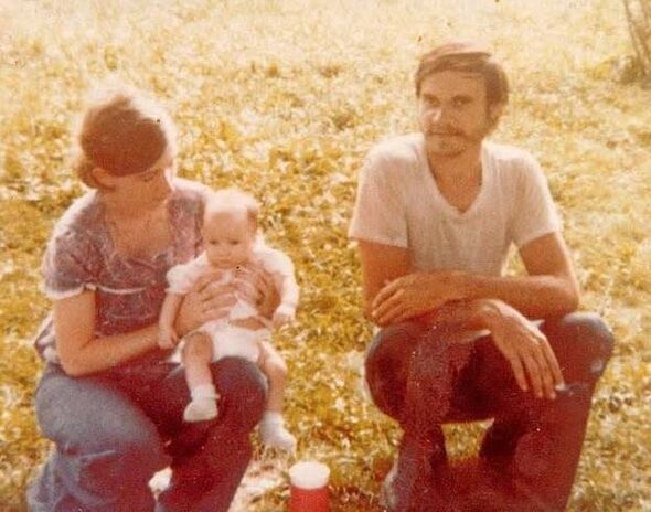 It's unclear if Gary Siders Jr. is the small baby pictured on his mother's lap, decades before they were handcuffed in Hamden, Ohio