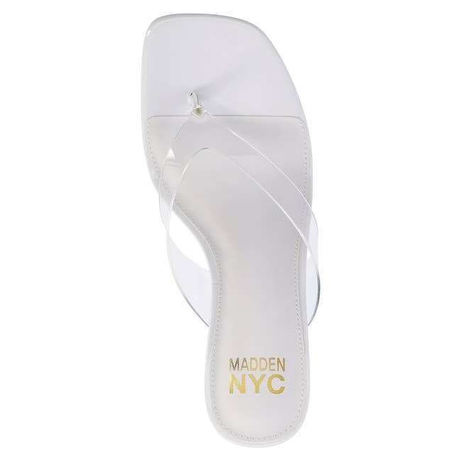 Stylish women's sandal with a transparent strap and a square toe design, branded