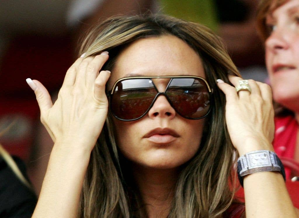 Huge aviators and lots of bling - VB accessorised to the max in 2006