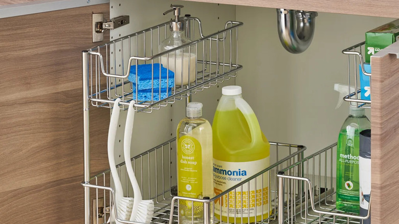 An undersink cabinet organized with Trinity's Wire Undersink Organizer with Slide