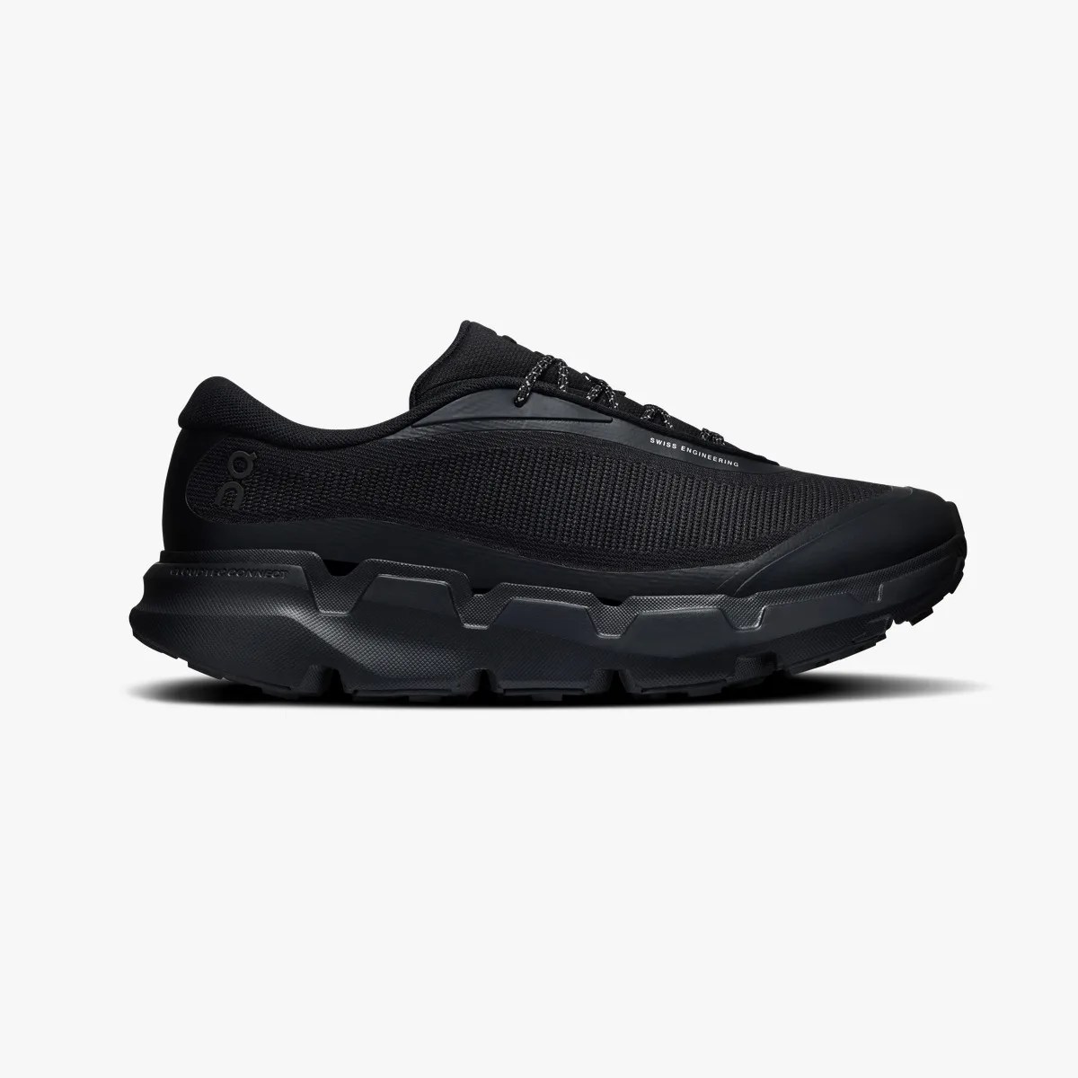 All-black athletic shoe with thick textured sole and mesh upper, side view.