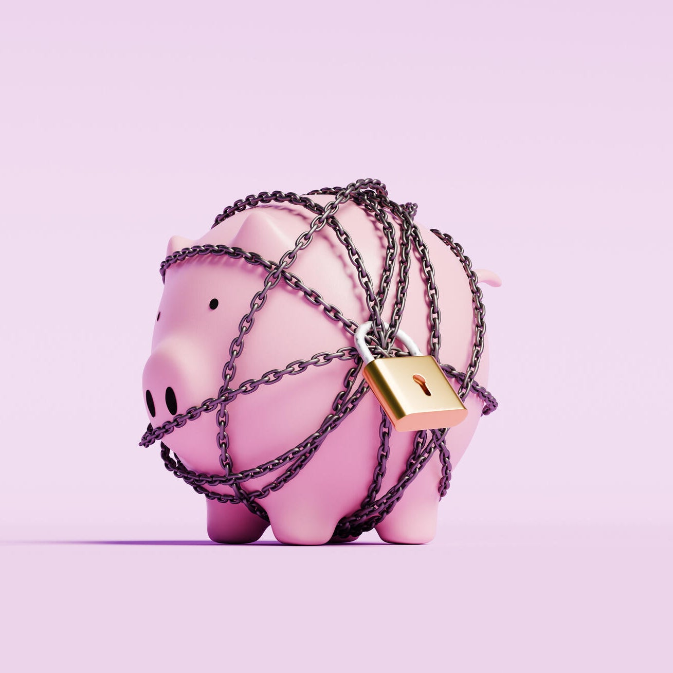 Piggy bank wrapped in a chain with a lock