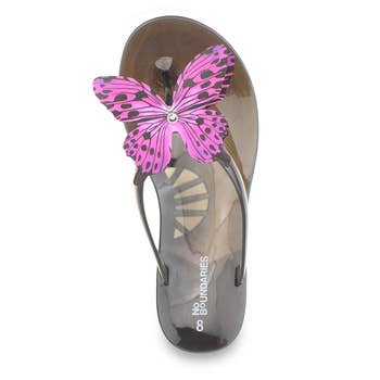 Flip-flop sandal with a butterfly design on the strap. Brand