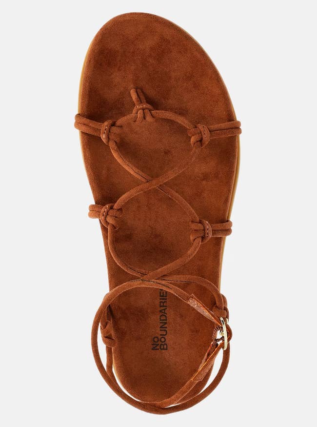 Brown suede sandal with a flat sole and thin straps across the top, suitable for casual wear