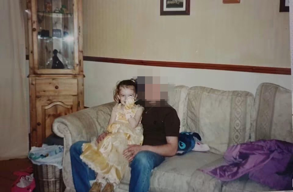 The photo Dee mentions in the piece, of when they were little and wearing a princess dress with boots, on the sofa at home with a parent
