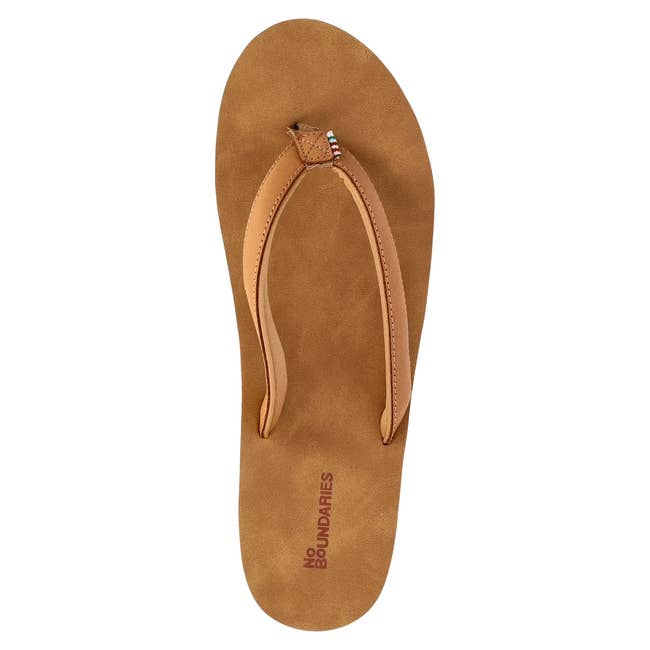 Top view of a single brown flip-flop sandal with beaded detail on the strap, labeled
