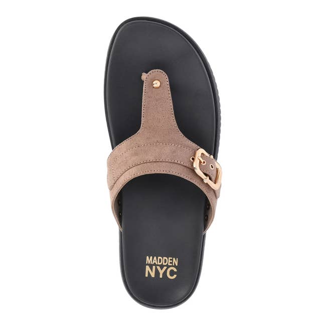 Top view of a Madden NYC sandal featuring a wide strap with a gold buckle, designed for casual wear