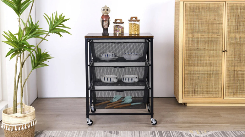 Edifice's 3-tier Mesh Basket Cart filled with serveware items and utensils