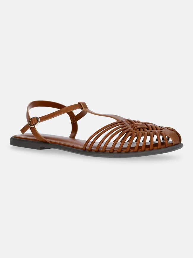 Brown strappy leather sandal with closed weave design and ankle strap, suitable for casual wear