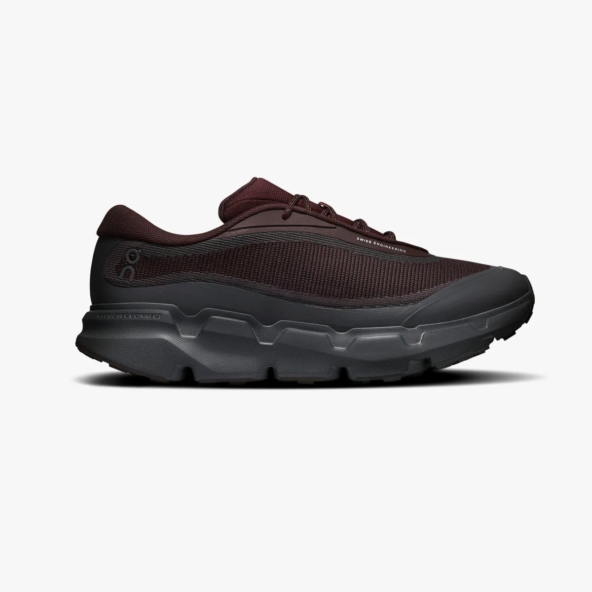 Dark maroon and black athletic shoe with thick textured sole and "Swiss Engineering" text on side.