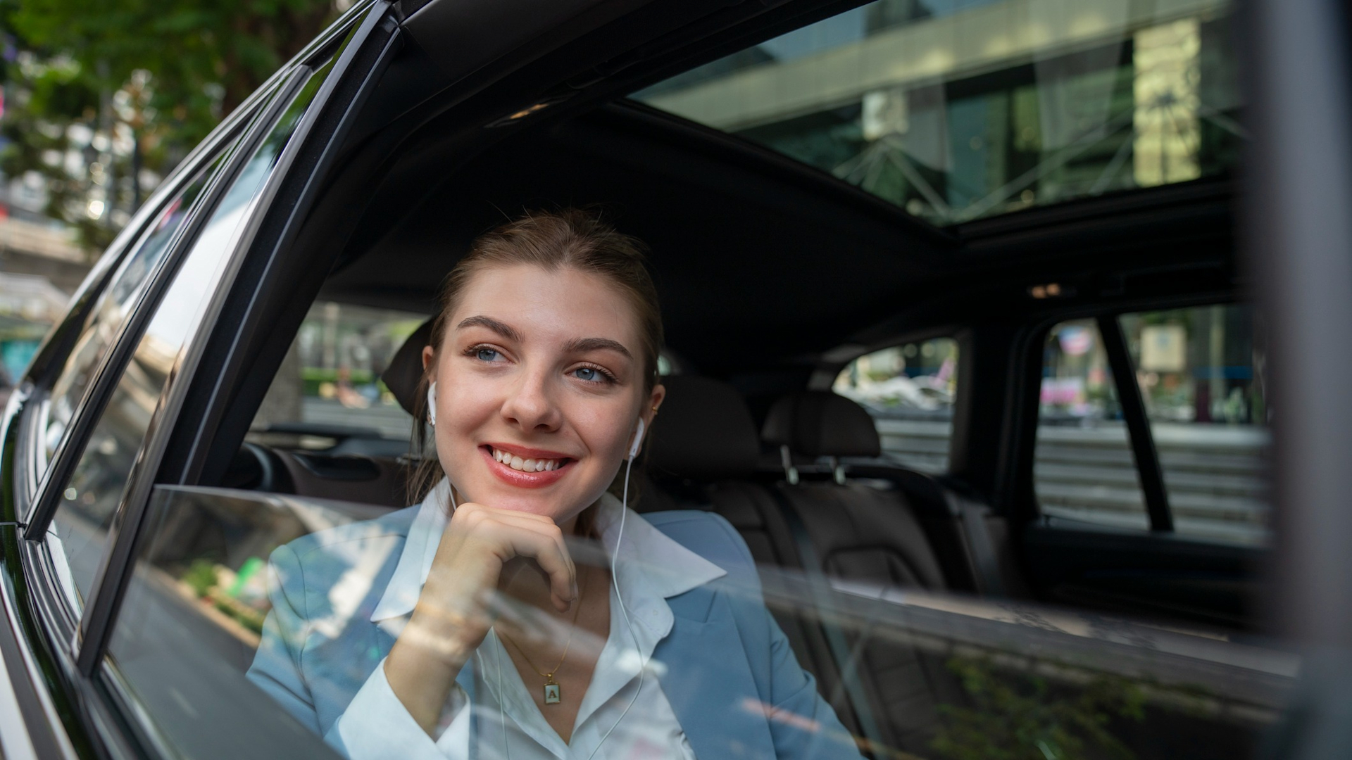 Discover a wealthy businesswoman getting escorted in a nice vehicle to her preferred location or work.