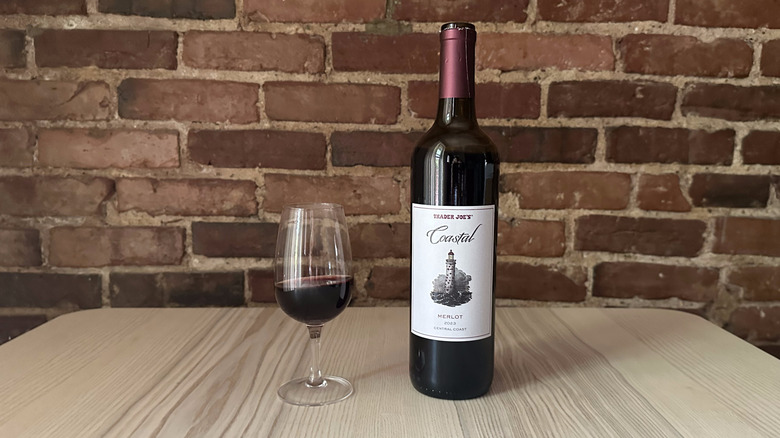 Bottle of Trader Joe's Coastal Merlot on wooden table