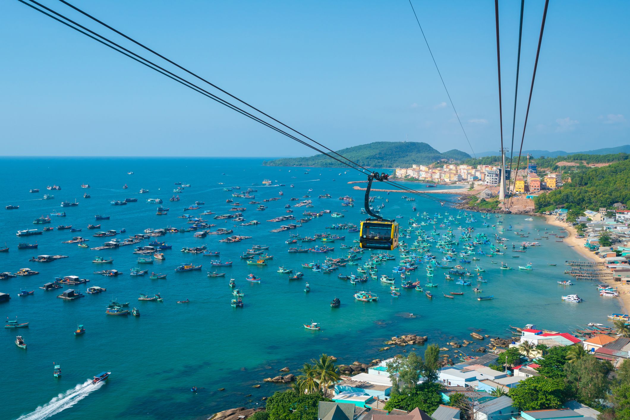 The Sun World Hon Thom tramway passes over the vibrant waters of Phú Quốc.