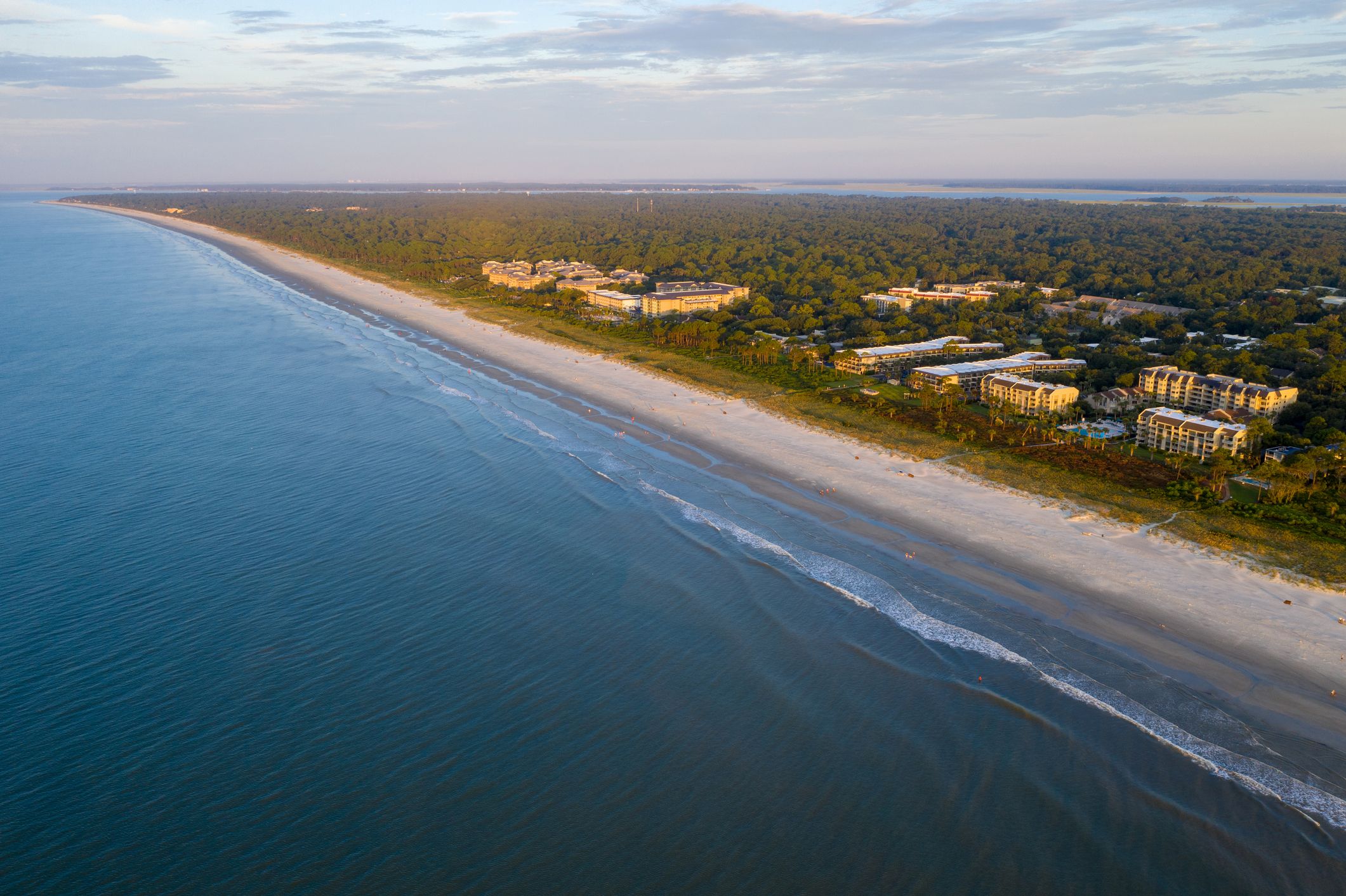 An overhead view of rich waters wading onto Coligny Beach