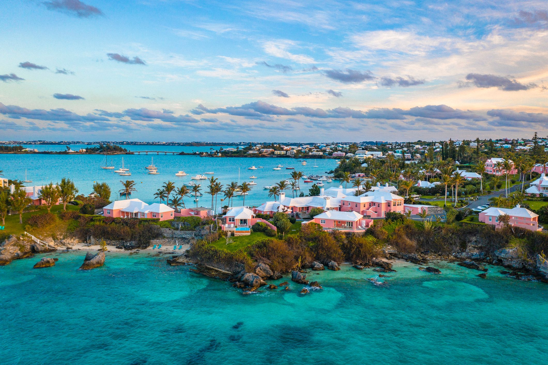 Yachts and pink bungalows line Cambridge Beach in Bermuda