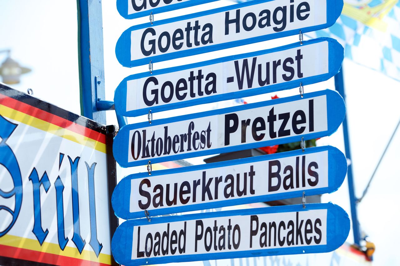 Sign listing food items at an event including Goetta Hoagie and Sauerkraut Balls