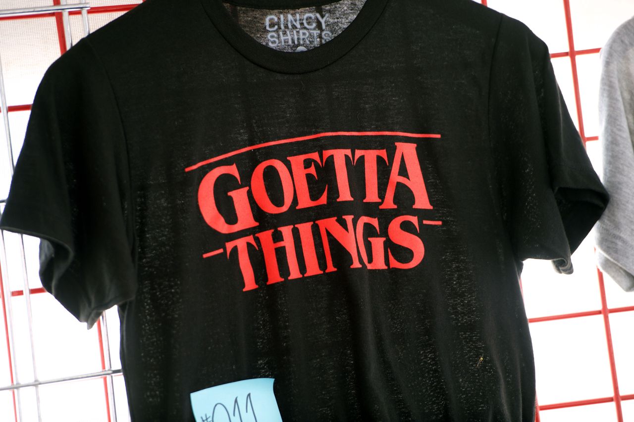 A black shirt with the phrase Goetta Things displayed on a rack