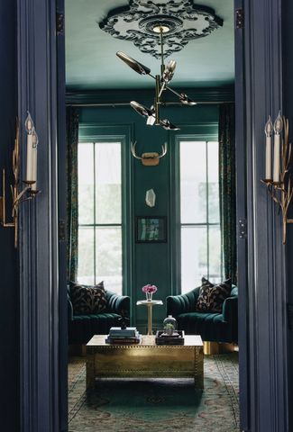 Moody living room with color drenched ceiling